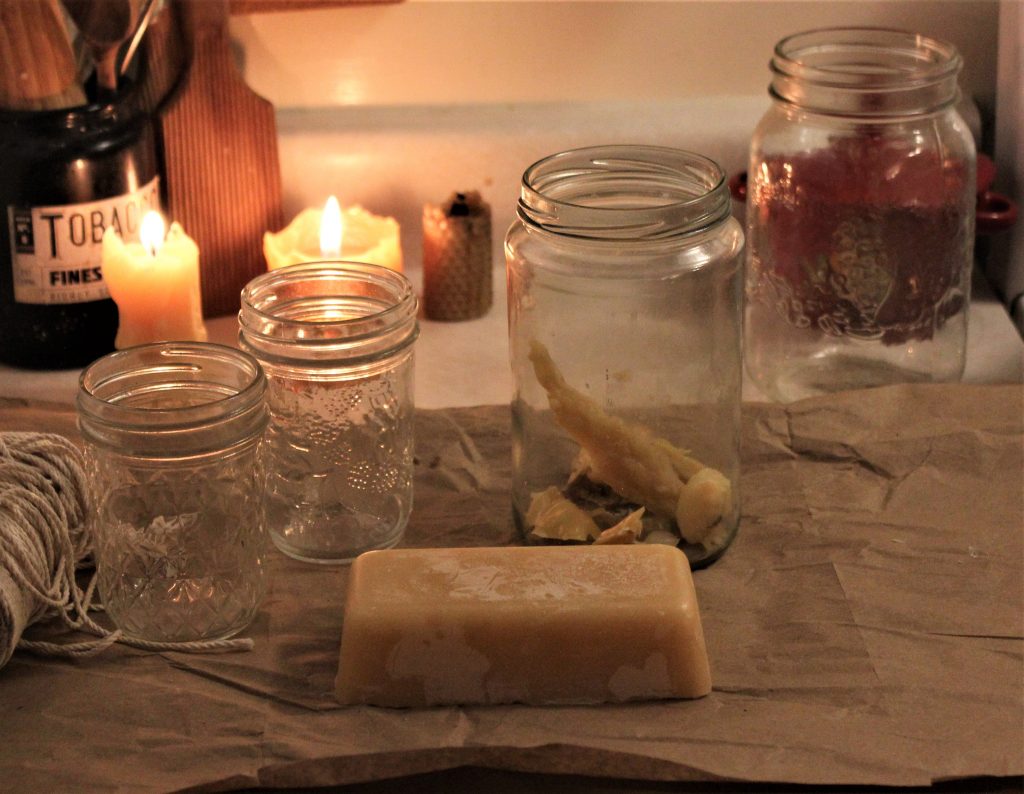 beeswax brick and jars on a counter top