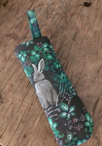 finished cast iron skillet handle mitt with bunny in brambles on it